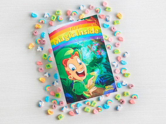 The Magic Inside book surrounded by Lucky Charms marshmallows