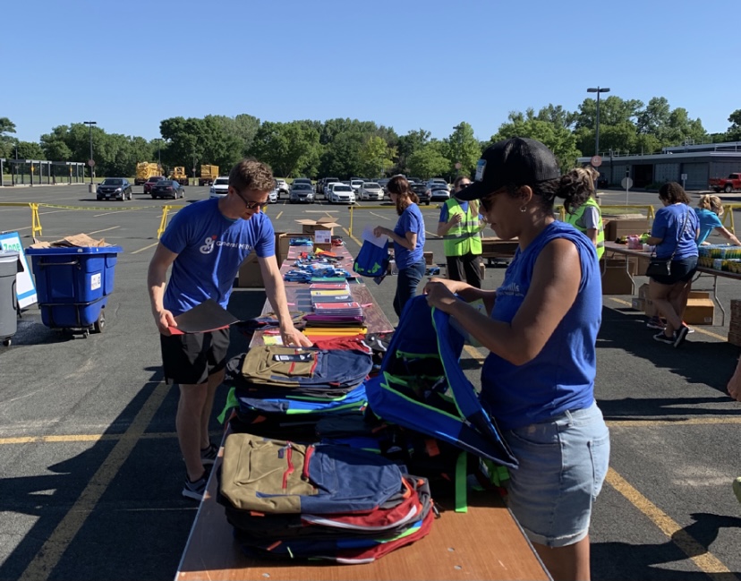 Employees packing backpacks on Juneteenth Day of Action